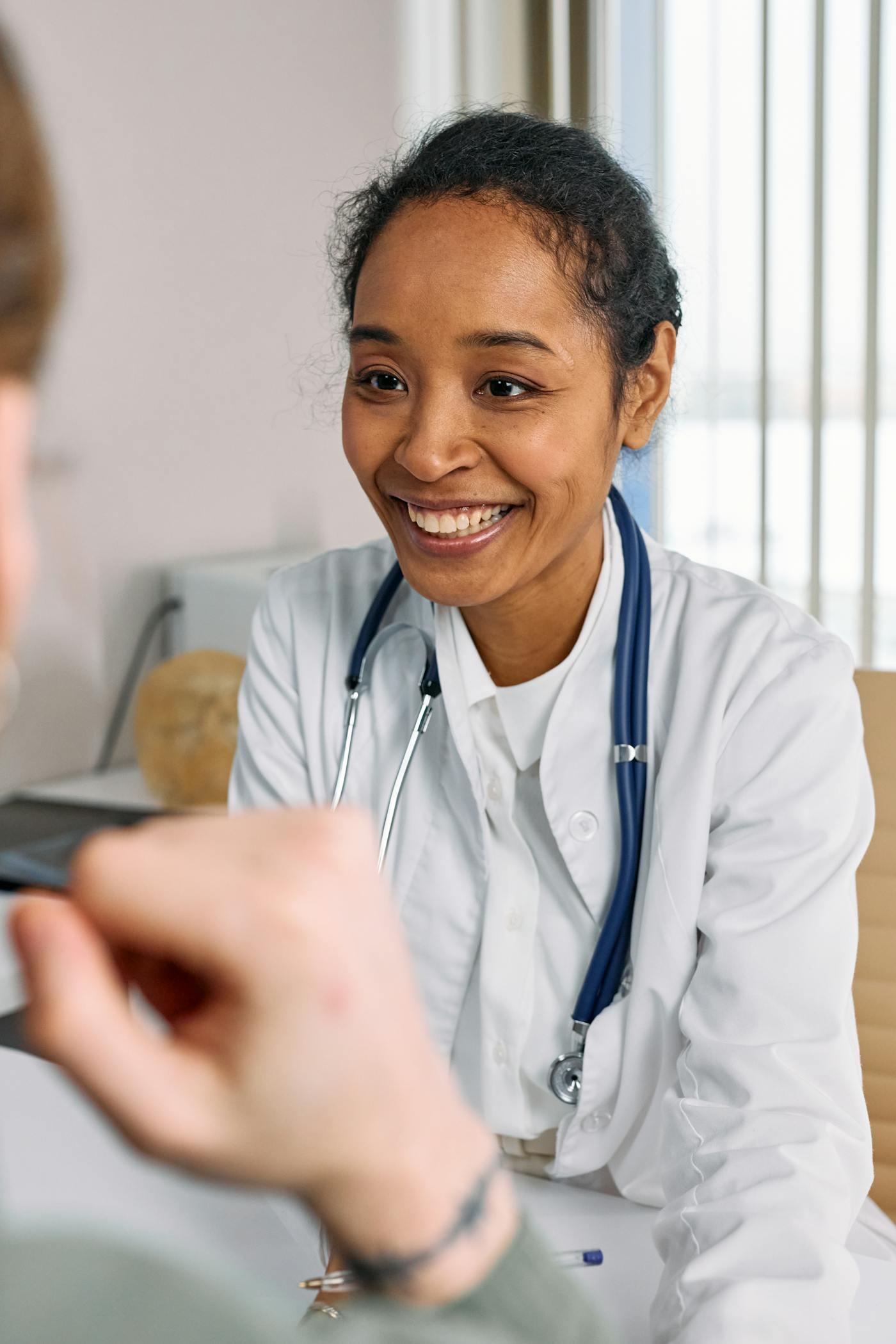 Front desk staff coordinating appointments with patient support